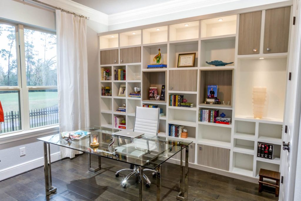 Closet Factory franchise clean organization franchises office space with custom shelving behind the desk